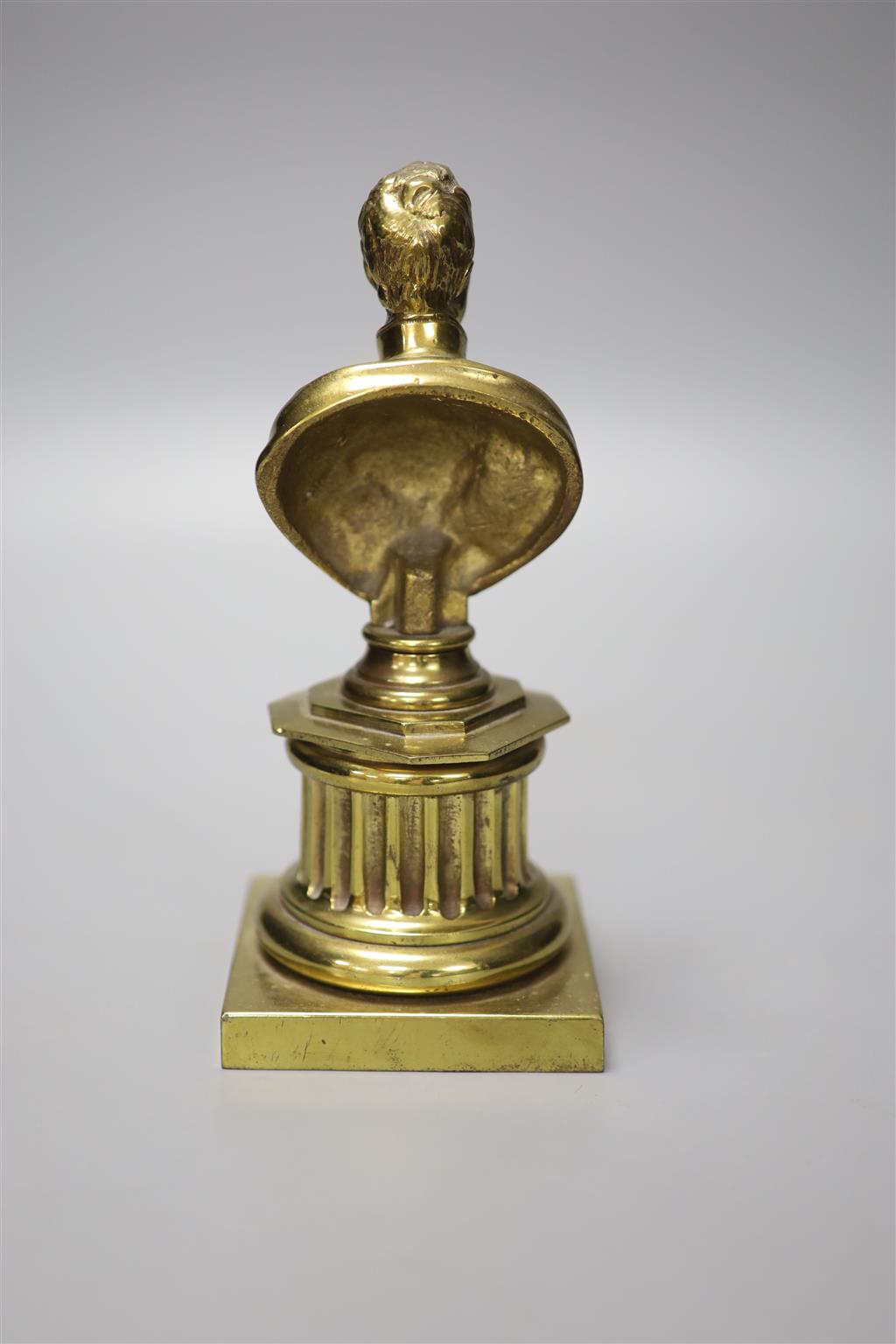 A 19th century brass bust of Wellington, 21cm high and two prints